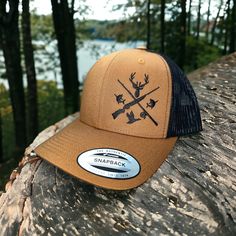 This awesome fishing and hunting design is embroidered on premium quality Yupoong six-panel trucker hat. The design placement is on the right side of the hat when looking at it.  How to Order: 1. Choose your hat color from the pictures. (We have a lot more colors available. Send us a message to check what we have available)  2. Pick the thread color you would like for the design.  Message us with if you have any questions.  Washing instructions: Hand wash cold only, wipe dirty areas only with a Fishing Trucker Hat Baseball Cap Style, Trucker Baseball Cap With Curved Brim For Fishing, Trucker Snapback Hat For Fishing, Fishing Trucker Cap With Curved Bill, Trucker Baseball Cap For Fishing With Curved Bill, Trucker Baseball Cap With Curved Bill For Fishing, Adjustable Baseball Cap For Fishing, Brown Trucker Hat For Camping, Adjustable Curved Bill Baseball Cap For Fishing