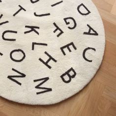 a white rug with black letters on it