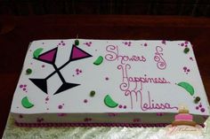 a sheet cake with white frosting and pink decorations