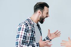 two people with their hands out to each other, one is screaming and the other has his mouth open