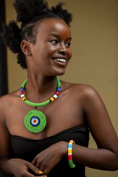 Unique African Maasai Handcrafted Beaded Necklace with an Elegant Look and Brilliant Finish. **GET FREE SHIPPING FOR ADDITIONAL ITEMS PURCHASED. Size(Around the Neck)-16 Inches. Color-Green and Multi-Color. Get a pair of Matching Earrings and 2 Bracelets for an extra $7. Yes, Buy Multiple Items and pay shipping for 1 item only- The rest ships Free. (No Limits on the number of Multiple items). With a faster delivery time of 3 days via DHLExpress, Worldwide. Ordinary/Standard Shipping also availab Green Wooden Beads Necklaces For Festivals, Unique Green Wooden Beaded Necklaces, Green Wooden Beaded Necklaces, Green Polished Beads Necklace For Festivals, Traditional Green Beaded Necklace With Large Beads, Green Polished Beaded Necklace For Festival, Traditional Green Beaded Round Necklaces, Traditional Green Beaded Necklaces With Wooden Beads, Green Wooden Beaded Necklaces For Festival