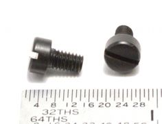 an image of screws and nuts on a white background with measuring tape next to it