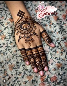 the hand is decorated with henna designs