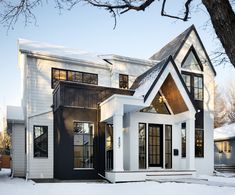 a white house with black trim and windows