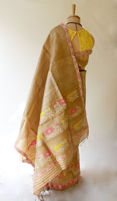 Muga Silk - The most valued silk from India. Almost exclusively reared and produced in Assam, India. It is indigenous to the Brahmaputra Valley and assiduously practiced in the districts of Assam. The moth is basically a wild moth. Hence it is categorised as Vanya Silk or Wild silk by the silk board of India.(http://csb.gov.in/silk-sericulture/silk/vanya-silk/) The yarn produced is a natural rich golden yellow or light brown colour depending on the host plant it feeds on. These are unique produc Ceremonial Gold Tussar Silk Traditional Wear, Ceremonial Silk Traditional Wear Handloom, Ceremonial Handloom Silk Dupatta, Luxury Bollywood Tussar Silk Shawl, Bollywood Gold Embroidered Tussar Silk Fabric