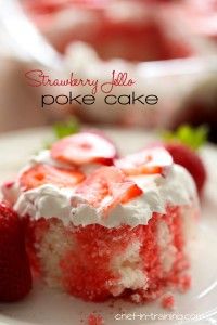 strawberry jello poke cake on a white plate