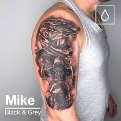 a man with a motorcycle tattoo on his arm