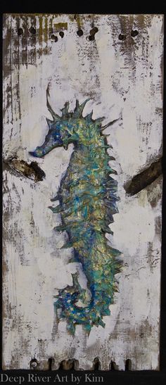 a painting of a sea horse on a piece of wood