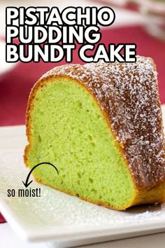 a piece of green cake sitting on top of a white plate with the words pistachio pudding bundt cake