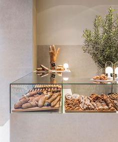 an assortment of breads and pastries on display