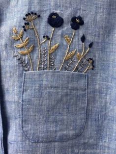 blue jeans with flowers in the pocket