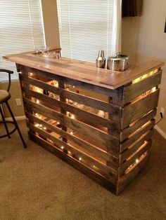 a bar made out of pallets with lights on it and the words, bar de pal