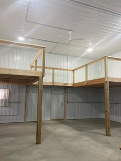 the inside of a storage building with two lofts