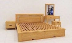 a wooden bed with drawers and a mirror on the wall next to it in a white room