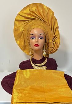 This stunning African head wrap, made from 100% cotton and crafted by PTBSTUDIO, is the perfect addition to any special occasion outfit. The intricately pleated design and beautiful gold colour make it ideal for a Nigerian wedding or any other celebration. One size fits all, making it suitable for women and girls alike. The set includes an auto gele and ipele, ready to wear and perfectly complements the elegant style of the head wrap. Made in the United Kingdom, this piece is a must-have for any Elegant Yellow Wedding Turban, Gold Ceremonial Sets With Traditional Drape, Elegant Gold Wedding Turban, Elegant Fitted Gold Headwrap, Elegant Gold Fitted Headwrap, Gele Styles, African Traditions, Occasion Outfit, African Head Wraps