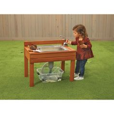 Expand your classroom space outdoors with this toddler-size outdoor mud kitchen!Real working pump can be used for sand and water explorationFor dramatic play outdoor fun, the sink doubles as a doll tub or kitchen sinkMeasures 27"L x 19"W x 23-3/4"HBucket and accessories not includedMade from eucalyptus wood-does not need to be treatedIdeal for outdoor classroom and outdoor learningClean with water and mild detergent or ble Toddler Mud Kitchen, Kids Outdoor Kitchen, Toddler Outdoor Play, Waldorf Playroom, Nature Classroom, Mud Kitchen For Kids, Kitchen For Kids, Nature Preschool, Outdoor Kids Play Area