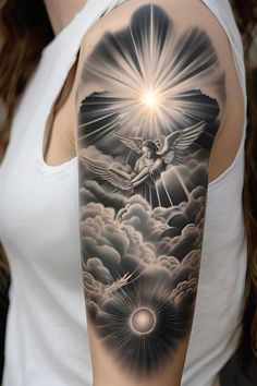 a woman's arm with an angel and sun tattoo on it