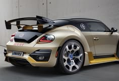 an image of a car that is gold and black