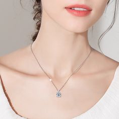 This exquisite pendant necklace features a stunning 1-carat moissanite held securely in a classic four-claw setting, perfect as a sophisticated women's necklace. Ideal for any occasion, it stands out beautifully among your moissanite necklaces and adds a touch of brilliance to your jewelry necklace collection. Embrace the refined beauty of this remarkable moissanite diamond necklace. ✧ Main stone Carat Weight: 1ct ✧ Stone Dimension: 6.5mm ✧ Necklace Length: 18" ✧ Stone Shape: Round ✧ Enhancement Silver Lab Grown Diamond Solitaire Necklace, White Solitaire Necklace With Round Pendant, Moissanite Solitaire Necklace With Round Pendant, Minimalist Moissanite Solitaire Necklace, Classic Diamond Solitaire Necklace With Clavicle Chain, Clavicle Chain Necklace With Moissanite, Minimalist Silver Moissanite Solitaire Necklace, Women's Necklace, Moissanite Necklace