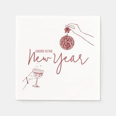 cheers to the new year greeting card with hand holding a wine glass and an ornament