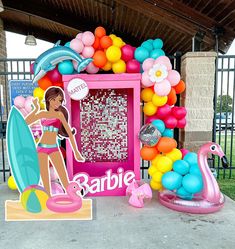 there is a barbie beach themed display in the yard