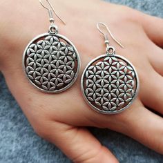 Introducing our Flower of Life Earrings! Handcrafted from sterling silver these earrings are a symbol of harmony and balance. Elevate your look with these intricate and timeless pieces.• Material: High-Quality Solid 925 Sterling Silver• Finish: Sterling Silver Rose Gold or Gold• A special piece you'll treasure• High-quality materials and attention to detail• Our jewelry is designed With 🖤️ In NY Symbolic Silver Earrings With Ear Wire, Symbolic Silver Pierced Earrings, Symbolic Silver Hypoallergenic Jewelry, Symbolic Silver Drop Earrings, Silver Symbolic Drop Earrings, Silver Spiritual Hoop Earrings, Silver Symbolic Hypoallergenic Earrings, Metal Symbolic Hypoallergenic Earrings, Silver Hypoallergenic Symbolic Earrings