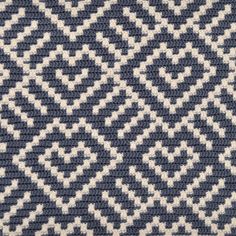 a blue and white knitted area rug