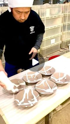 a man in a chef's hat is making cookies