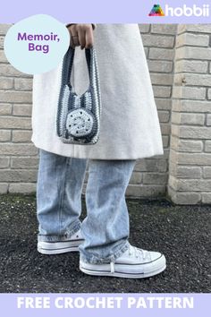 a person holding a crochet purse with the text free crochet pattern