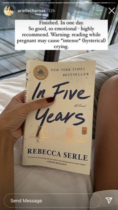 a person holding up a book in front of their face with the title in five years written on it