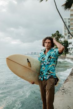 This is an authentic Hawaiian shirt! Handmade on the island of Oahu in the city of Honolulu, We just can't get enough of the sunsets! Available in small (S), medium (M), large (L), extra-large (XL), 2XL,3XL,4XL,5XL,6XL,7XL. Colors available in green, blue, and red. We add a special unique finishing touch to our shirts, real coconut buttons. Yes, we can make buttons from coconuts. And we did. Each button is different from the next, just as each wave that hits the shore is different from the last. They're unique, but oh so similar.  Check out more Made in Hawaii Gifts: https://www.etsy.com/shop/NinthIsle?ref=simple-shop-header-name&listing_id=866131097 Hawaiian Short Sleeve Camp Shirt For Surfing, Summer Hawaiian Shirt For Surfing, Hawaiian Camp Shirt For Surfing, Tropical Green Short Sleeve Shirt For Beach, Green Tropical Short Sleeve Shirt For Beach, Green Hawaiian Camp Shirt For Beach, Girls Halter Dress, Bulk Gifts, Wrap Pants