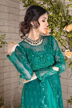 Emerald hued net front-open heavily embroidered jacket featuring glistening sequins, beads, pearls, crystals, stones and silk thread embroidery, attached to pure raw silk pleated gown, paired with heavily sequins embellished net dupatta, a wardrobe must have this wedding season. Gown Fabric: Net & Pure Raw Silk Length: Jacket length 48”, Gown Length 58” (customisable mention in order notes) Dupatta Fabric: Net Color: Emerald Green This is a two-piece outfit including gown & Draped dupatta. All o Silk Thread Embroidery, Pleated Gown, Designer Outfit, Crystals Stones, Pakistani Dress, Green Beads, Net Dupatta, Pakistani Designers, Thread Embroidery