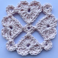 the crochet pattern is made up of four squares, each with one smaller square at the center