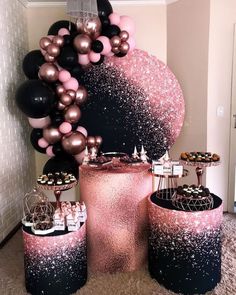 pink, black and gold party decorations with balloons in the shape of a ballon