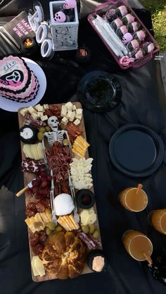 a table topped with lots of different types of food and drinks on top of it