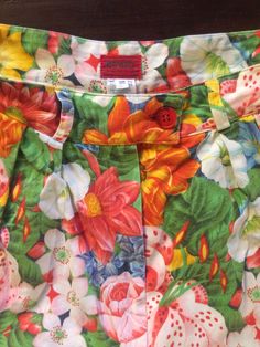 Cool Kenzo Paris multi colored floral printed high waisted shorts. Perfect 80's high fashion street wear. Fabric is a medium weight cotton. Shorts have pleats in the front, darts at the waist in back. Side front pockets. Cuff at the shorts hem. Front plastic zipper with button at the waist. Label Kenzo Paris, Size 38, 100% cotton, wash cold, hang dry. Very good vintage condition with no fabric or sewing flaws. Measurements Waist 62cm/ 24.5inches Hips 102cm/ 40inches Waist to hem 44cm/ 17inches M Retro Printed Bottoms For Spring, Retro Cotton Shorts For Spring, Fitted Floral Print Shorts, Retro Floral Print Short Bottoms, Retro Floral Print Bottoms For Spring, Cotton Floral Print Shorts For Spring, Vintage Printed Bottoms For Spring, Retro Floral Print Shorts, Multicolor Floral Print Cotton Shorts