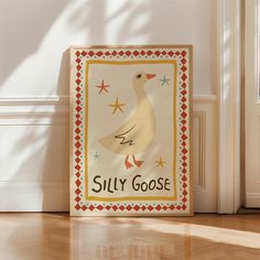 a sign that says silly goose on the side of a wall next to a door