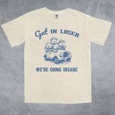 Get In Loser We're Going Insane is a funny vintage cartoon style Comfort Colors® 1717 Unisex T-Shirt.  This retro tee would be a humorous addition to your wardrobe or a great gift idea for a Meme Lover Friend!  SHIRT DETAILS     *COMFORT COLORS®  1717      *Comfortable Relaxed Unisex Fit, please refer to sizing chart in listing photos.     *For Oversized Fit we recommend going 2 sizes up from your normal size.     *Relaxed Fit.     *100% ring-spun cotton.     *Sewn-in twill label.     *Medium fa Friend Shirt, Silly Shirt, Funky Hats, Vintage Cartoons, Get In Loser, Funny Tshirt Design, Funny Vintage, Sarcastic Shirts, Retro Tee