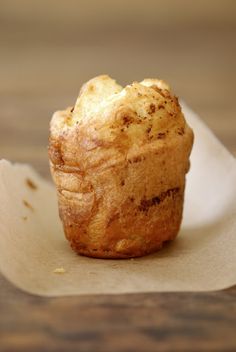 a muffin sitting on top of a white napkin