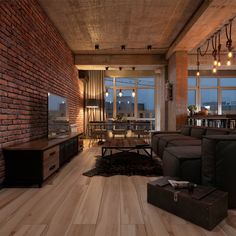 a living room filled with furniture and a flat screen tv sitting on top of a hard wood floor