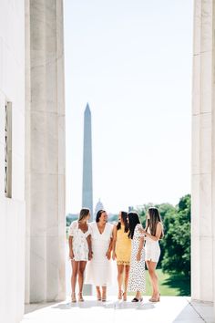 four women standing in front of the washington monument