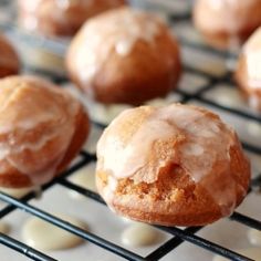 glazed donuts are cooling on a rack