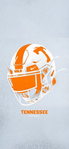 an orange and white football helmet with the word tennessee on it's front side