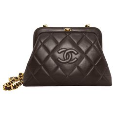 Incredibly stunning Chanel frame style bag from the 1980s. Deep chocolate brown quilted supple leather with contrasting warm gold hardware. Push down on the snap closure tab to open the frame and reveal the iconic maroon leather interior that all vintage Chanel bags have. Optional crossbody/shoulder chain strap. The chain strap rings flip down and are hidden if carrying this as an evening clutch. The chain strap is very long at 28", great if you are very tall. It can be knotted to sit slightly h Vintage Chanel Purse, Vintage Chanel Bags, 80s Handbags, Chanel Vintage Bag, 1980s Chanel, Vintage Chanel Bag, Chanel Clutch, Luxury Bags Collection, Quilting Frames