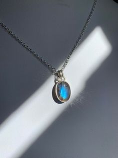 -Handmade from fine silver bezel wire, sterling silver and labradorite - Your choice of 18 or 20 inch solid sterling silver chain - 20mm tall and 12mm wide ~Metaphysical Properties~ -regulates metabolism -stimulates intuition -useful companion through times of change -banishes fears and insecurities -strengthens faith and trust in yourself and the universe Silver Labradorite Dainty Jewelry, Dainty Silver Labradorite Jewelry, Dainty Silver Labradorite Necklace, Silver Round Labradorite Necklaces, Silver Labradorite Necklaces, Silver Labradorite Round Necklace, Silver Oval Labradorite Necklace, Silver Labradorite Oval Necklace, Minimalist Silver Necklace With Labradorite