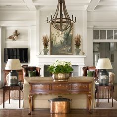 a living room filled with furniture and a chandelier