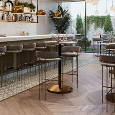 an empty restaurant with bar stools and barstools