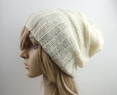 Amazing unisex hat, handknitted by me using pure australian wool in cream/off-white. With extra wide ribbing this hat looks slouchy and trendy, will keep you warm and stylish! Completely unisex design, great for sharing between boyfriend/girlfriend.  Item is MADE TO ORDER, please allow 7-12 days for me to knit Composition - 100% australian wool. Care - hand wash only in warm water, dry flat away from heat. Size - medium/large adult size, very stretchy. Knit Slouchy Hats, Slouchy Hat, Winter Beanie, Boyfriend Girlfriend, Wide Bands, 12 Days, Unisex Design, Cream White, Warm Winter