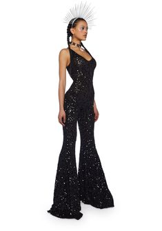 cuz you’ve got them mesmerized. This jumpsuit has a stretchy sequin construction, flare pants, an open back, and cross straps. Sleeveless Disco Jumpsuit For Night Out, Glamorous Stretch Sequin Jumpsuits And Rompers, Glamorous Stretch Jumpsuits And Rompers For Night Out, Glamorous Stretch Jumpsuits And Rompers For Evening, Glamorous Backless Jumpsuits For Night Out, Sequin Backless Jumpsuits And Rompers For Party Season, Evening Sequined Stretch Jumpsuits And Rompers, Evening Stretch Sequin Jumpsuits And Rompers, Sequin Backless Jumpsuits And Rompers For Night Out