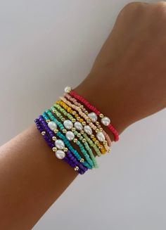 "Beaded stretch bracelet with pearl and gold bead detail Comes in various colors and designs Bracelets are made to order and design varies by bracelet (note, design might not be the same as pictured) Sizing (inches): 5.75\" 6\"  6.25\"  6.5\"  6.75\" 7\"  7.5\" Sizing Guide: Use a flexible measuring tape or a string that you can put up to a hard ruler.  Or print off a paper ruler! Make sure the measuring tape is wrapped around your wrist so it touches the skin in it's entirety.  Colors: Strawber Creative Bracelets, Petite Jewelry, Flexible Bracelet, Bracelets Handmade Diy, Trending Bracelets, Strawberry Pink, Diy Bracelet Designs, Beads Bracelet Design, Green Mint